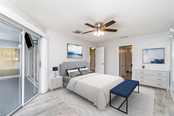 Bedroom with ceiling fan, light hardwood / wood-style flooring, and access to exterior
