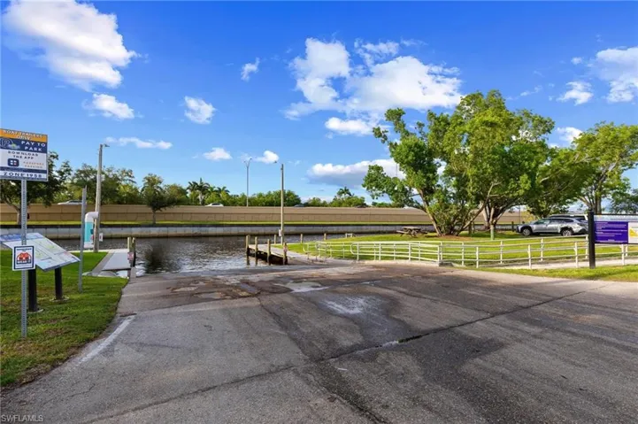 Dock area featuring a boat ramp and a water view