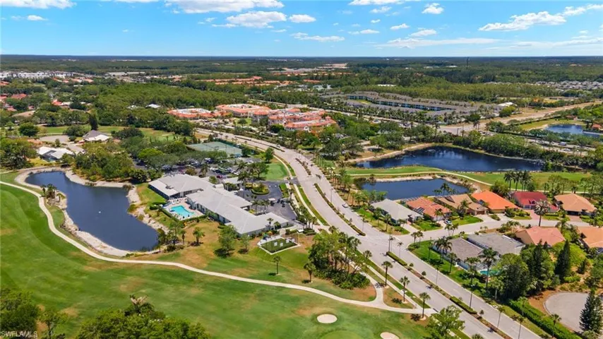 Birds eye view of property with a water view, golf course view, and a residential view