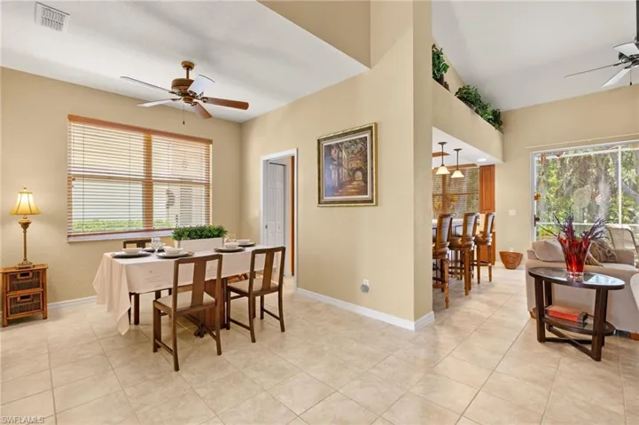 Dining area featuring baseboards, plenty of natural light, a ceiling fan, and visible vents