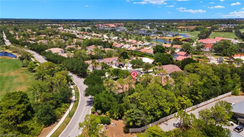 Bird's eye view featuring a water view, view of golf course, and a residential view