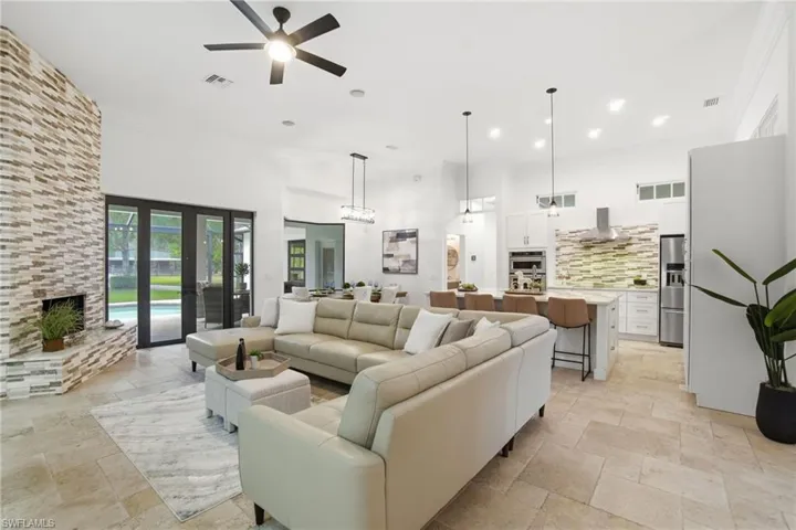 Family area opens to the main area of the house and has French door access to pool