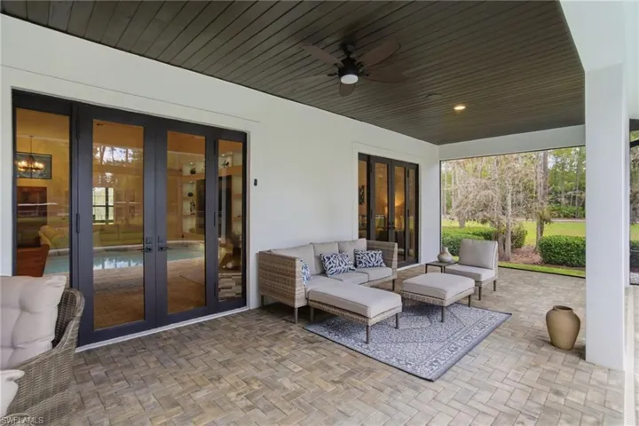 View of patio featuring french doors to the inside, ceiling fans, and an outdoor hangout area