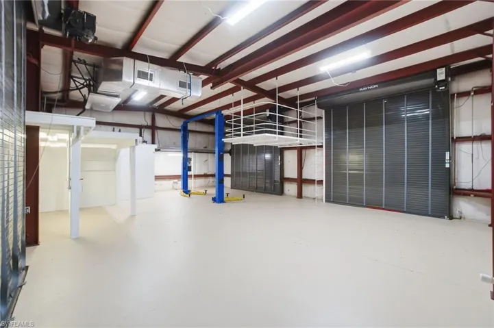 View of inside of garage with car lift.  The detached garage is air conditioned.