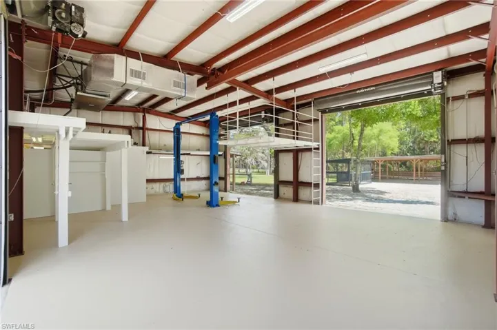 View of inside of garage with doors open