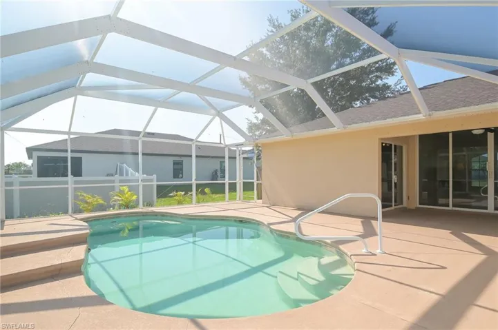 View of pool featuring a lanai and a patio area