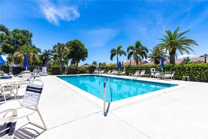 Community pool with a patio area