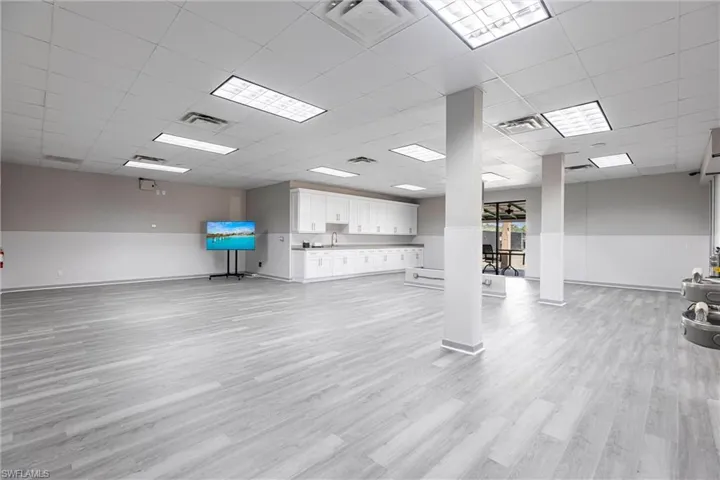 Unfurnished living room with a paneled ceiling and light wood-style floors