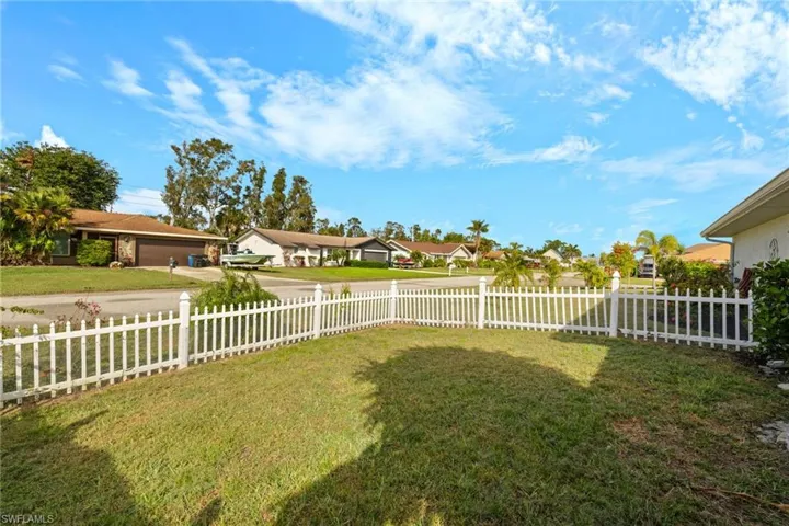 Bedroom featuring dark wood-type flooring and ceiling fan