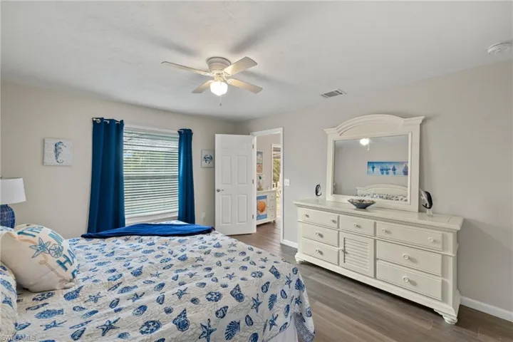 Bedroom featuring wood-type flooring and ceiling fan