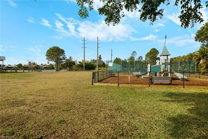 View of play area featuring a yard