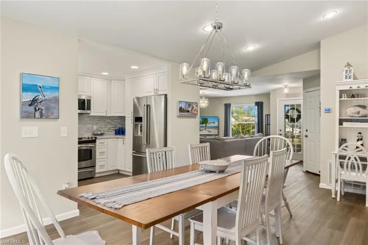 Living room featuring hardwood / wood-style floors and a chandelier