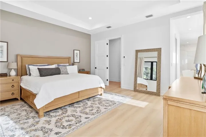 Bedroom featuring light wood-type flooring, recessed lighting, and baseboards
