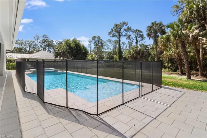 View of pool featuring a pool with connected hot tub and a patio
