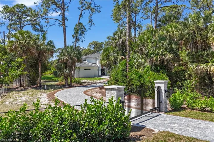 Fenced yard featuring a gate