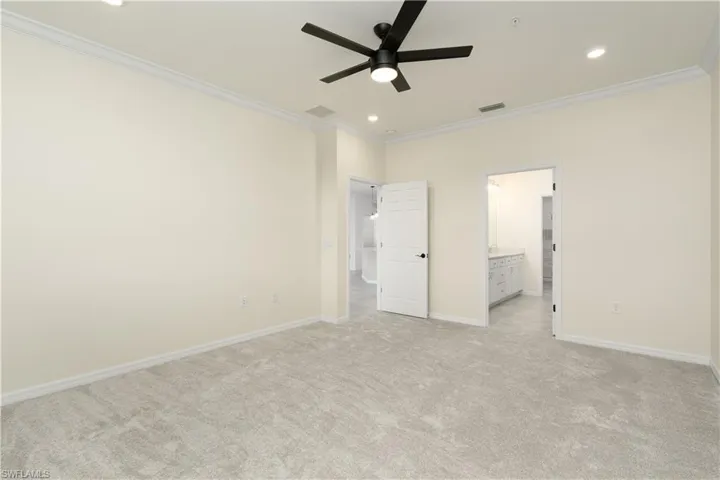 Unfurnished bedroom with light carpet, ornamental molding, recessed lighting, and baseboards