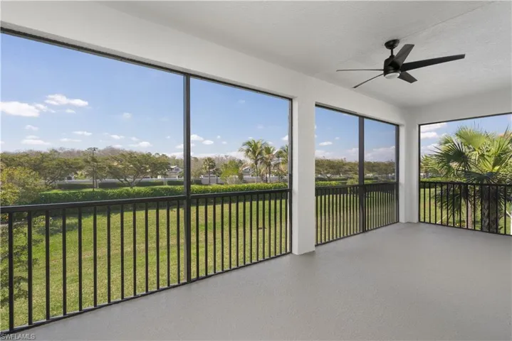 Unfurnished sunroom with a ceiling fan
