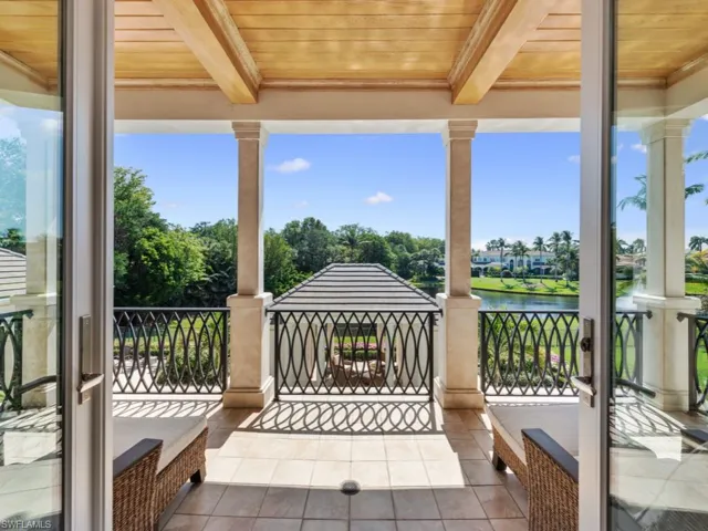 2nd floor balcony with view of pool, cabana and lake