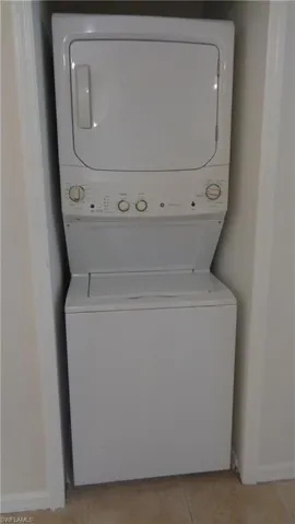 Laundry featuring stackable washer and dryer