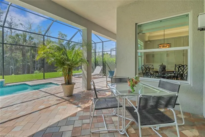View of patio / terrace with a lanai and an outdoor pool