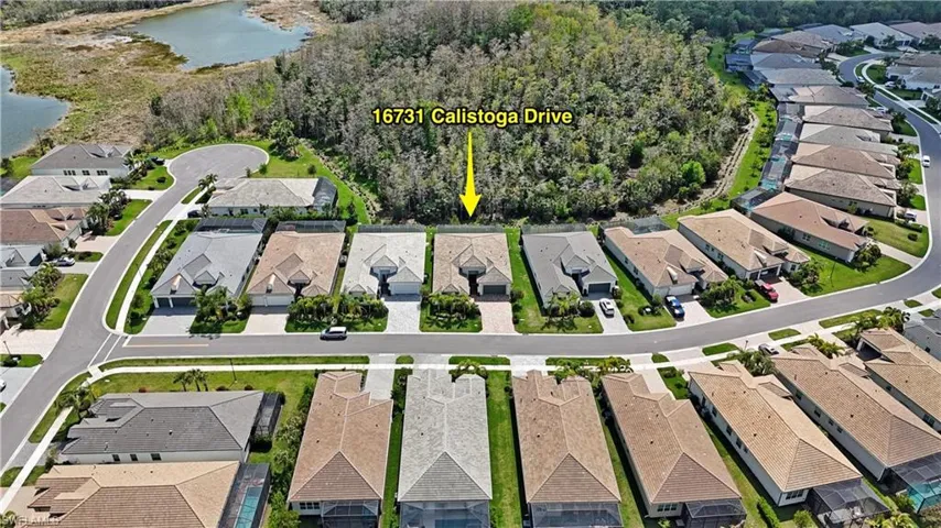 Bird's eye view with a water view and a residential view