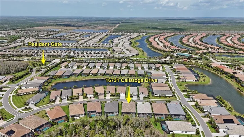 Aerial view featuring a residential view and a water view
