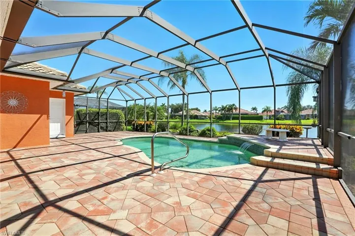 Lovely pool & waterfall beside the ample lake views