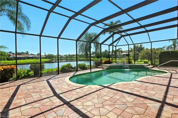 Lovely pool & waterfall beside the ample lake views