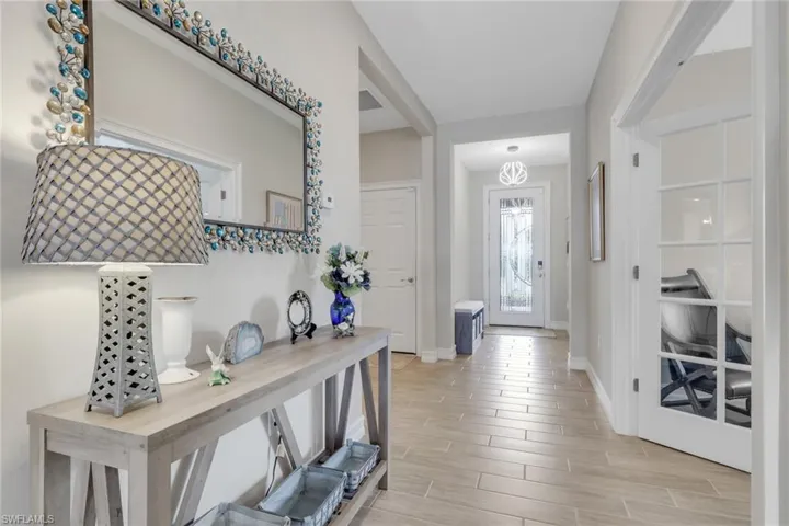 Entrance foyer with tiled floors on offset running pattern