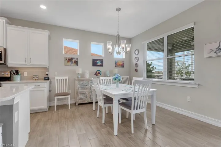 Dining room featuring wood finish floors and suspended lighting