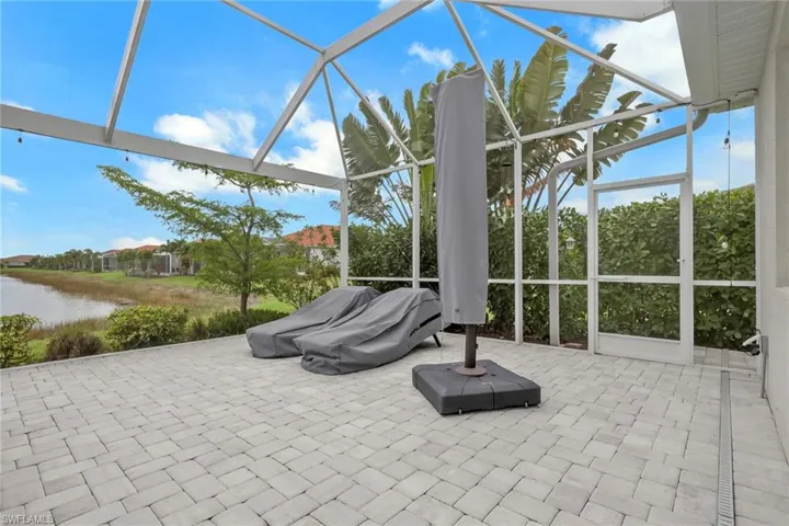 Extensive side landscaping. Optional patio furniture has covers.