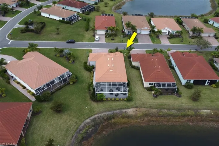 Rear aerial perspective feature extensive landscaping which provides a private setting on the lanai