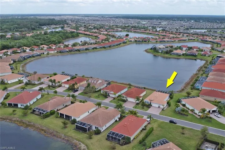 Froont aerial overview of property's location featuring expansive lake view