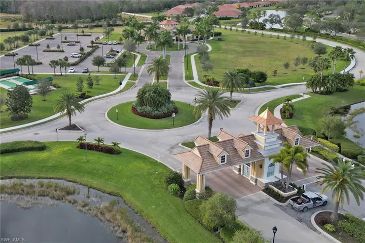 Aerial view of secure entry and clubhouse in the distance