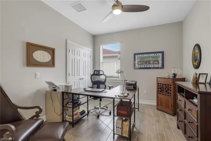 Office or 4th bedroom featuring french doors, tiled floors and ceiling fan