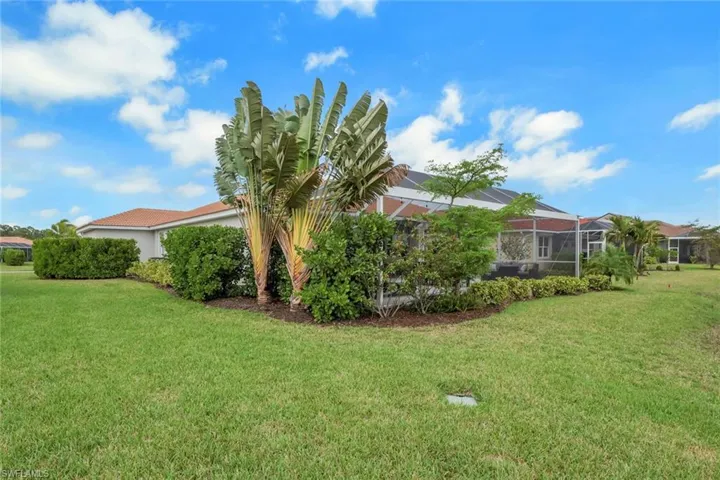 Extensive professional landscaping providing a privacy barrier to lanai
