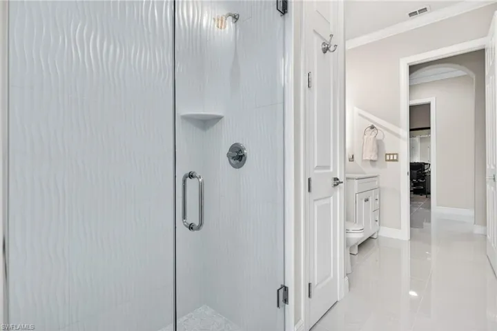 Third full bathroom walk-in shower featuring floor to ceiling tile.
