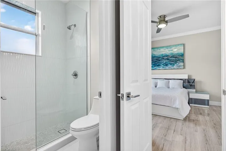 Floor to ceiling tile shower.