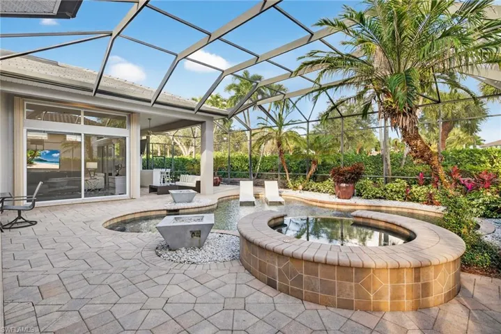 View from in ground spa looking across pool to entertaining area.