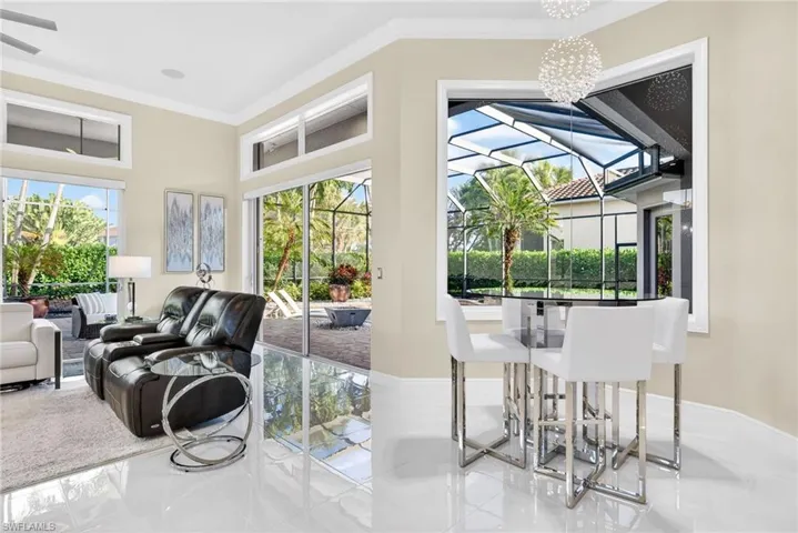 Casual dining with view into family room and outdoor lanai.