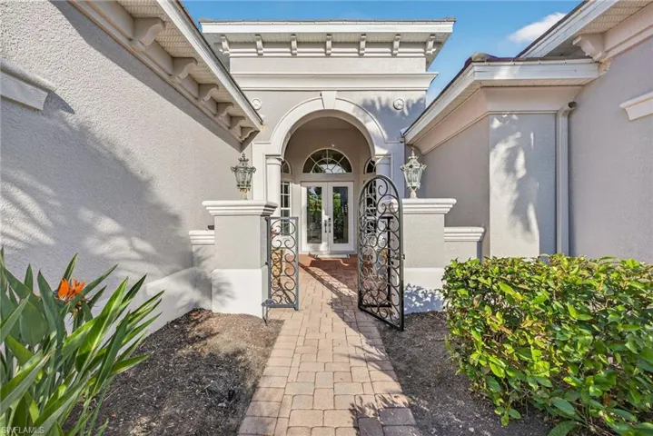Gated courtyard entry adds additional outdoor living space and privacy.  Includes fully electric roll-down storm protection on front entry.