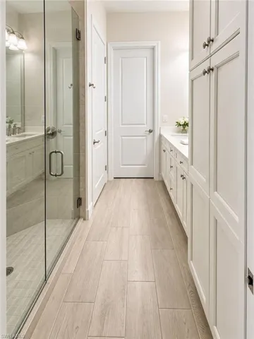 Walk-in shower with clear glass enclosure