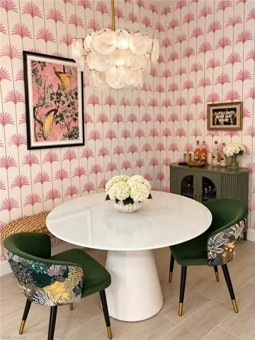Decorative wallpaper, modern chandelier, tile flooring, built-in cabinetry