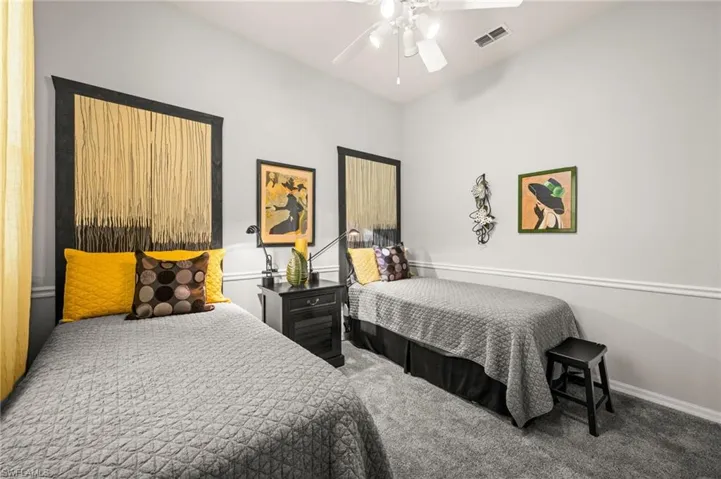 Bedroom featuring carpet and ceiling fan