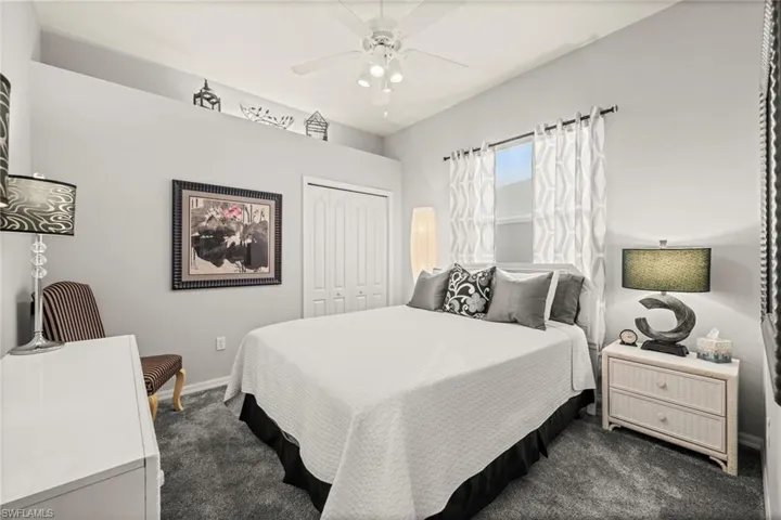 Bedroom featuring carpet, a closet, and ceiling fan