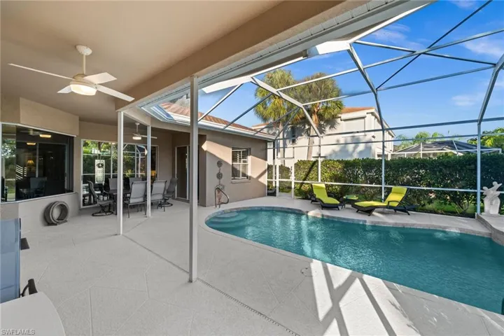 Swimming pool with a patio, outdoor dining space