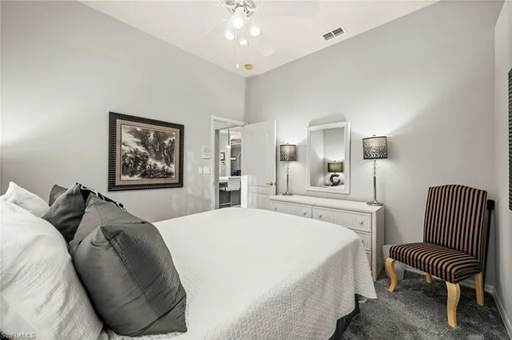Bedroom featuring carpet and ceiling fan