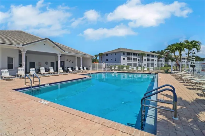 Community pool featuring a patio