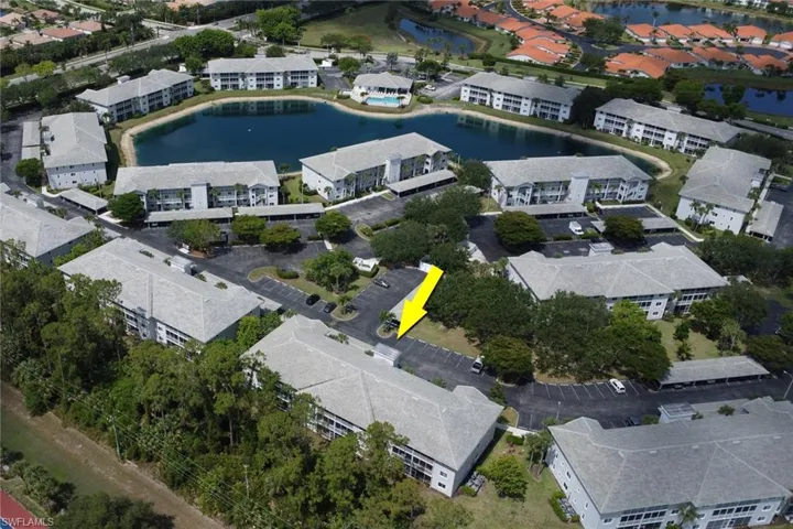 Aerial view of property's location with a large body of water