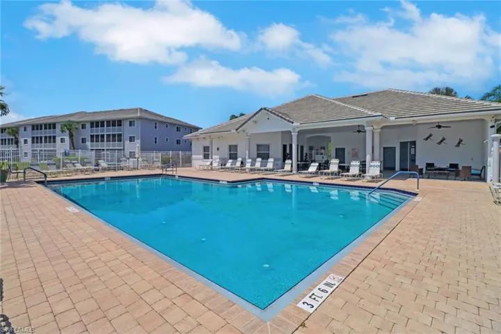 Community pool featuring ceiling fan and a patio area
